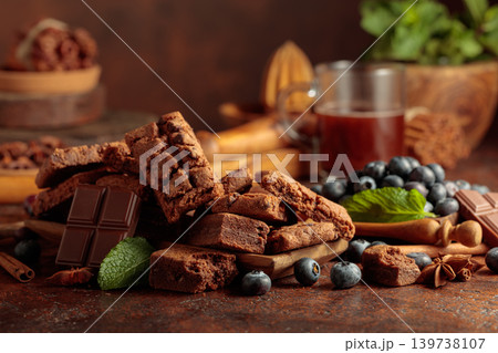 Brownie with blueberries and mint. 139738107