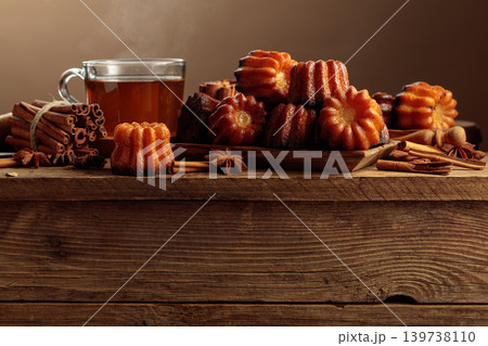 Cinnamon cakes and tea on an old wooden table. 139738110