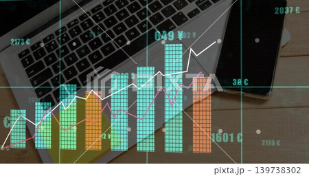 Displaying multicolored financial data visualization over work desk, with laptop and smartphone Displaying multicolored financial data visualization over work desk, with laptop and smartphone 139738302