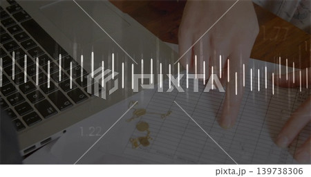 Tracing woman's hands marking ledger on wood desk, showing laptop waveform 1 Tracing woman's hands marking ledger on wood desk, showing laptop waveform 1 139738306