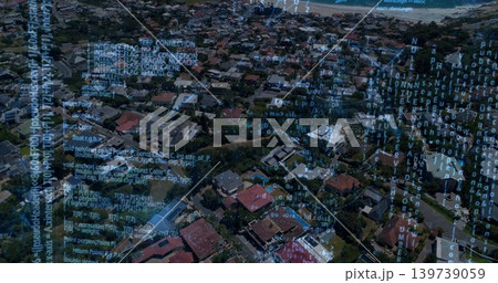 Showing high-altitude coastal neighborhood, displaying detached houses, parked cars, code overlay 139739059