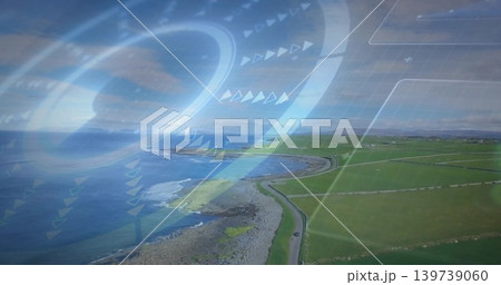 Surveying aerial coast tracing curving road and rocky shoreline by fenced fields with vehicle, HUD Surveying aerial coast tracing curving road and rocky shoreline by fenced fields with vehicle, HUD 139739060