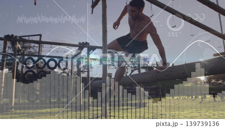 Vaulting shirtless athletic man clearing wooden beam at training park with tires, HUD overlay Vaulting shirtless athletic man clearing wooden beam at training park with tires, HUD overlay 139739136