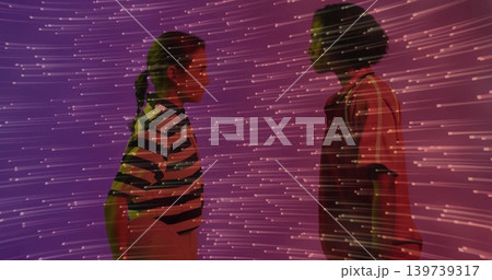 Standing women facing each other in purple gallery projecting streaks, wearing stripes and overalls Standing women facing each other in purple gallery projecting streaks, wearing stripes and overalls 139739317