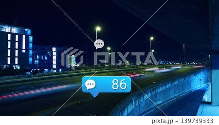 Curving multi-lane highway flowing under lamps at night, showing light trails and badge 86 Curving multi-lane highway flowing under lamps at night, showing light trails and badge 86 139739333
