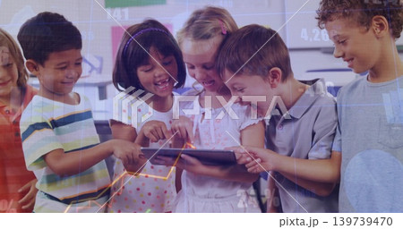 Gathering seven students and teacher pointing and tapping tablet in classroom, showing data overlay 139739470