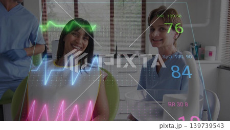 Smiling patient in white bib sitting in green dental chair at clinic blue-scrubbed staff vitals HUD Smiling patient in white bib sitting in green dental chair at clinic blue-scrubbed staff vitals HUD 139739543