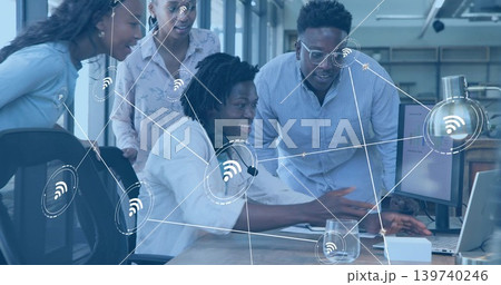 Pointing team business casual demonstrating on laptop at office with headset monitor Wi-Fi graphics Pointing team business casual demonstrating on laptop at office with headset monitor Wi-Fi graphics 139740246