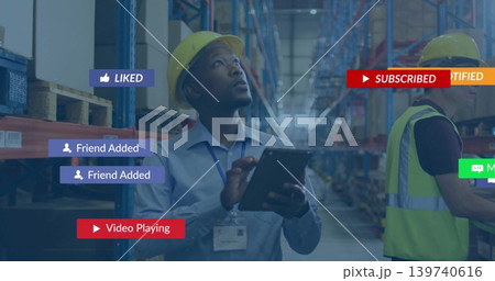 Inspecting worker in yellow hard hat with tablet, checking warehouse shelves with banners Inspecting worker in yellow hard hat with tablet, checking warehouse shelves with banners 139740616