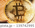 Bitcoin coin stacked with other cryptocurrency coins showcasing digital currency in a close-up view under bright light. High quality photo 139742995