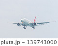 Mai Khao Phuket Thailand 2025 11 25: Nordwind Airlines Boeing 777-200ER prepares to land over Mai Khao Beach, approaching Phuket Airport in Thailand on a clear day with a blue sky. High quality photo 139743000