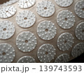 White massage applicator pads on a textured fabric surface. Home wellness tool for relaxation, acupressure, and body care 139743593