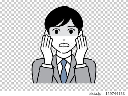A young male office worker in a suit, visibly shaken, with both hands covering his cheeks. A young male office worker in a suit, visibly shaken, with both hands covering his cheeks. 139744188