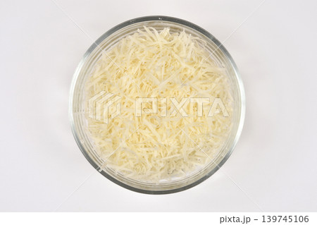 Grated Cheese in Glass Bowl Grated Cheese in Glass Bowl 139745106