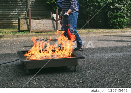 fire prevention. corporate safety - exercise during a firefighting course fire prevention. corporate safety - exercise during a firefighting course 139745441