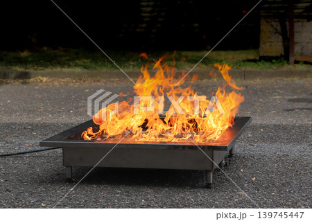 fire prevention. corporate safety - exercise during a firefighting course fire prevention. corporate safety - exercise during a firefighting course 139745447