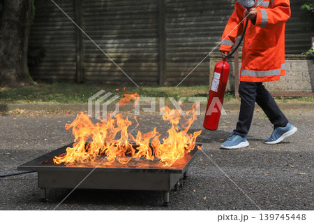 fire prevention. corporate safety - exercise during a firefighting course 139745448