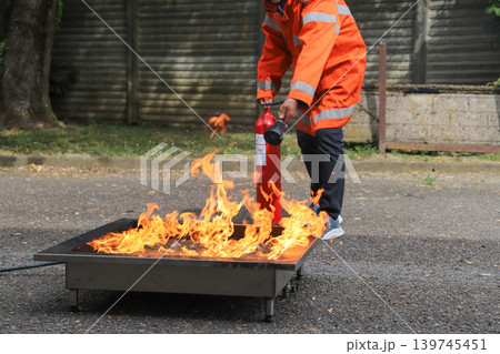 fire prevention. corporate safety - exercise during a firefighting course fire prevention. corporate safety - exercise during a firefighting course 139745451