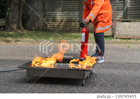 fire prevention. corporate safety - exercise during a firefighting course 139745455