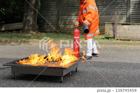 fire prevention. corporate safety - exercise during a firefighting course fire prevention. corporate safety - exercise during a firefighting course 139745459