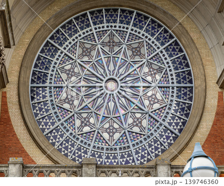 Framed by an elegant arched stone vault and detailed Corinthian-style columns, the striking red and yellow brick South facade of Alexandra Palace London iconic, Grade II-listed "Ally Pally" is 139746360