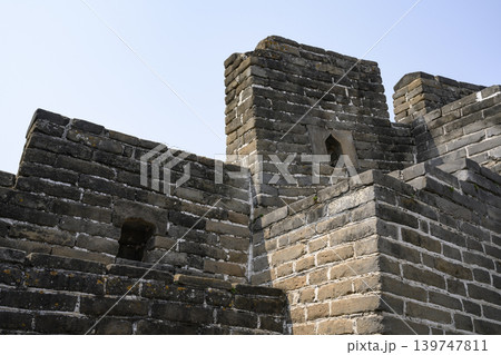 A close-up view of a wall fragment and brickwork of Great Wall of China in Mutianyu district, China A close-up view of a wall fragment and brickwork of Great Wall of China in Mutianyu district, China 139747811