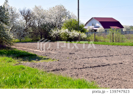 Rural landscape with plowed vegetable garden land. Rural landscape with plowed vegetable garden land. 139747923