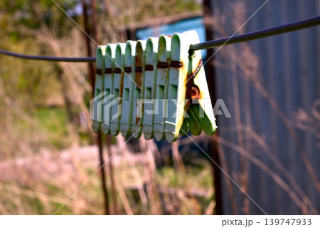 Old plastic clothespins. 139747933