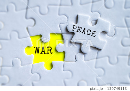 War and Peace yellow puzzle pieces on gray jigsaw background, global conflict resolution and international relations concept 139749118