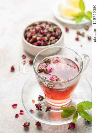 Pink rose herbal tea with dried buds and mint Pink rose herbal tea with dried buds and mint 139749380