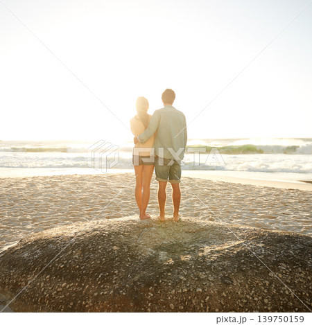 Sunset beach, love and back of couple in nature with hug, support and bonding, travel or vacation. Summer, mockup and people embrace at sunrise with sunshine, ocean view or date at sea in Florida Sunset beach, love and back of couple in nature with hug, support and bonding, travel or vacation. Summer, mockup and people embrace at sunrise with sunshine, ocean view or date at sea in Florida 139750159