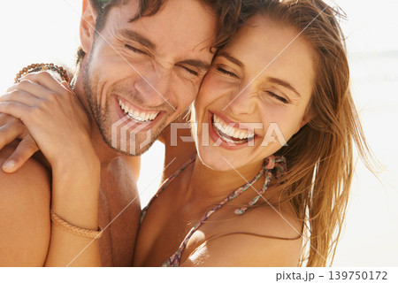 Laugh, couple and hug at a beach with comic, humor or bonding, comedy or silly joke in nature. Face, love and funny people embrace at the ocean with goofy moment on summer, holiday or travel vacation Laugh, couple and hug at a beach with comic, humor or bonding, comedy or silly joke in nature. Face, love and funny people embrace at the ocean with goofy moment on summer, holiday or travel vacation 139750172