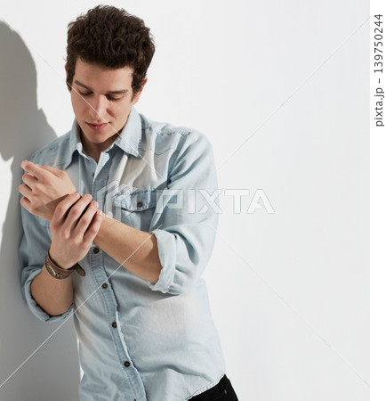 Fashion, man and stylish clothes in studio on mockup space isolated on a white background. Cool, casual and young person in apparel, wear arm strap on hand and trendy model thinking on a backdrop 139750244