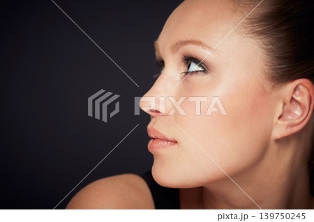 Skincare, face and woman in studio for dermatology, shine or wellness treatment on black background. Cosmetic, beauty and profile of female model with glowing skin mockup, detox or self care results Skincare, face and woman in studio for dermatology, shine or wellness treatment on black background. Cosmetic, beauty and profile of female model with glowing skin mockup, detox or self care results 139750245