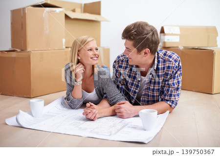 Man, woman and happy with floor plan blueprints for home renovation or moving boxes, apartment or investing. Couple, ground and paper for house development for improvement, buying or new beginning Man, woman and happy with floor plan blueprints for home renovation or moving boxes, apartment or investing. Couple, ground and paper for house development for improvement, buying or new beginning 139750367