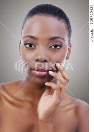 Skincare, portrait and black woman with beauty and confidence in studio, background or salon. Nails, makeup and serious model with healthy natural glow on skin from cosmetics, facial or dermatology Skincare, portrait and black woman with beauty and confidence in studio, background or salon. Nails, makeup and serious model with healthy natural glow on skin from cosmetics, facial or dermatology 139750420