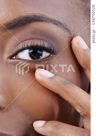 Eye, closeup and black woman with beauty, vision and skincare with dermatology. Half, portrait and African model with natural makeup and nails on face with healthy skin from cosmetics or facial 139750520