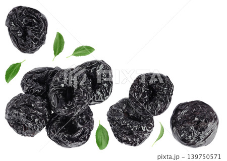 Prunes isolated on white background, heap of dried plums. Top view. Flat lay Prunes isolated on white background, heap of dried plums. Top view. Flat lay 139750571