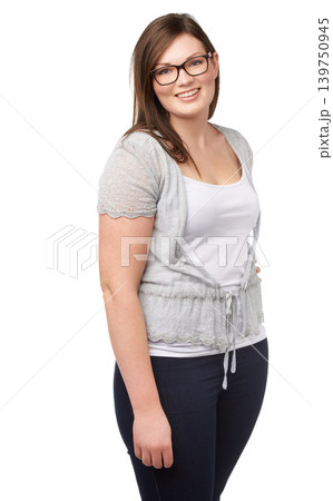 Fashion, portrait and plus size model with confidence, glasses and smile isolated on white background. Self care, body positivity and happy woman with natural beauty, wellness and casual in studio. 139750945