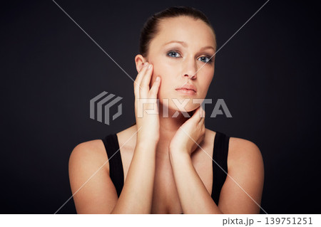 Skincare, portrait and woman in studio for dermatology, shine or wellness treatment on black background. Cosmetic, beauty and female model with hands on face for glowing skin, detox or self care Skincare, portrait and woman in studio for dermatology, shine or wellness treatment on black background. Cosmetic, beauty and female model with hands on face for glowing skin, detox or self care 139751251