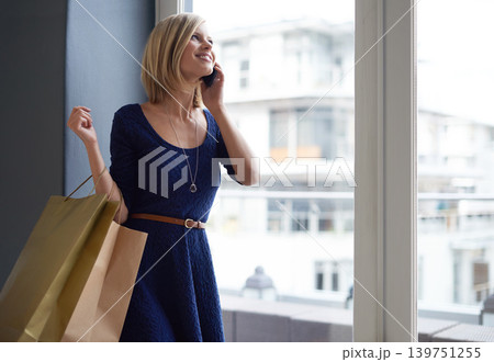 Phone call, shopping bags and woman customer by window of retail fashion store or boutique. Happy, smile and female person with style on mobile conversation with cellphone for communication in mall. Phone call, shopping bags and woman customer by window of retail fashion store or boutique. Happy, smile and female person with style on mobile conversation with cellphone for communication in mall. 139751255