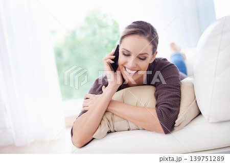 Woman, smile and relax on sofa for phone call, communication and mobile networking at home. Happy lady, smartphone and audio contact for conversation, gossip and chat to digital connection in lounge 139751289
