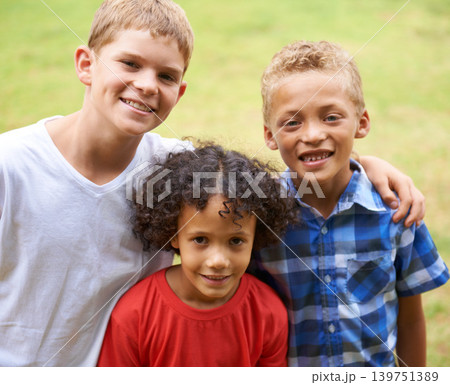 Boys, friends and portrait or happy outdoor in summer with confidence, pride or diversity in nature. Children, face or smile on grass field with embrace for friendship, care and support on playground Boys, friends and portrait or happy outdoor in summer with confidence, pride or diversity in nature. Children, face or smile on grass field with embrace for friendship, care and support on playground 139751389