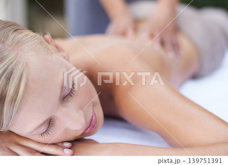 Woman, massage therapist and spa for treatment, back and sleeping for wellness and stress relief therapy. Face, masseuse and relaxing in resort, peaceful and hands for luxury body care or tranquility 139751391