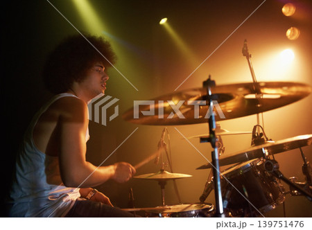 Stage, performance and man on drums at concert playing jazz, beat and talent for music. Drummer, musician and creative person in theater with rhythm for percussion, instrument or show at night 139751476