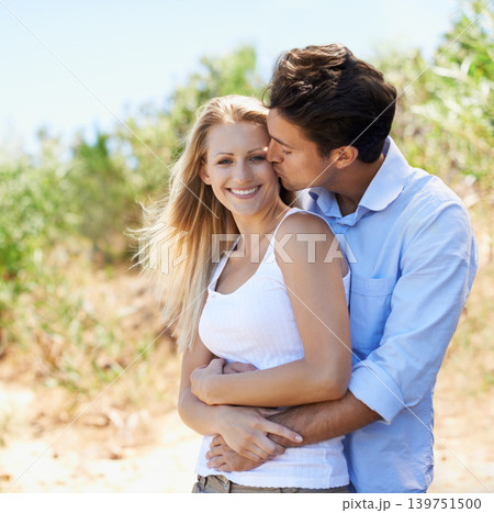 Couple, portrait and happy in nature with kiss in relationship for holiday, vacation or travel. Romance, man and woman with smile outdoor in forest with embrace for bonding, love or relax in woods Couple, portrait and happy in nature with kiss in relationship for holiday, vacation or travel. Romance, man and woman with smile outdoor in forest with embrace for bonding, love or relax in woods 139751500