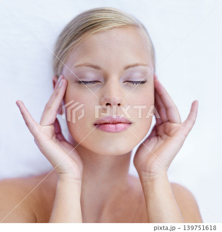 Woman, massage face and relax in closeup for wellness, peace and calm for beauty treatment on holiday break. Model, touch and temples with cosmetology for skin and facial care by white background Woman, massage face and relax in closeup for wellness, peace and calm for beauty treatment on holiday break. Model, touch and temples with cosmetology for skin and facial care by white background 139751618