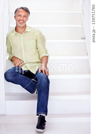 Portrait, mature man and happy on stairs in confidence for career and business in workplace. Person, smile face and senior entrepreneur relax in start up company and enterprise by white staircase Portrait, mature man and happy on stairs in confidence for career and business in workplace. Person, smile face and senior entrepreneur relax in start up company and enterprise by white staircase 139751760