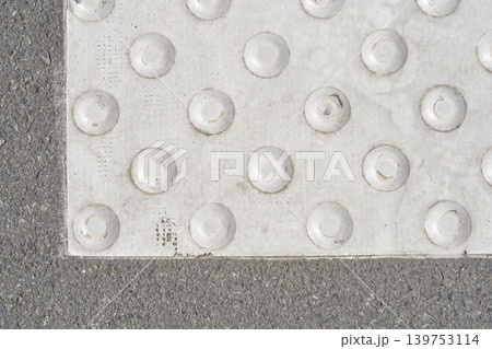 White Tactile Paving on Asphalt for Blind Pedestrians 139753114