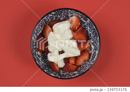 Fresh Sliced Strawberries with Cream in a Decorative Bowl Fresh Sliced Strawberries with Cream in a Decorative Bowl 139753178